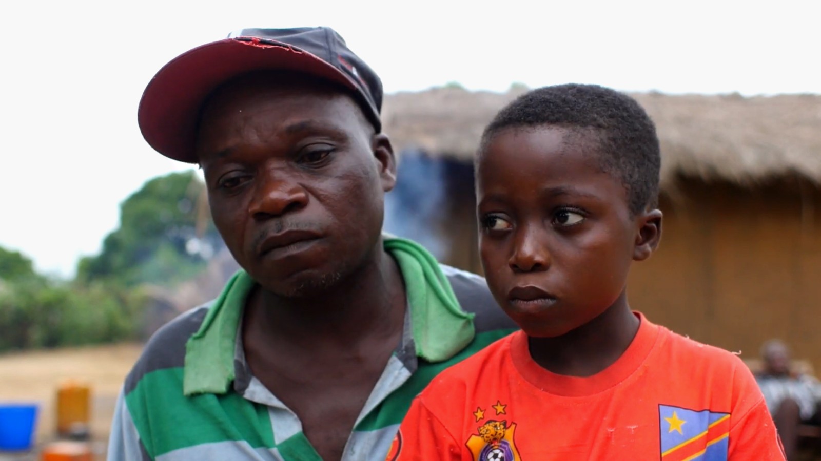 12-year-old Guy is shown with his father.
